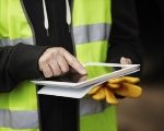  man on site using tablet